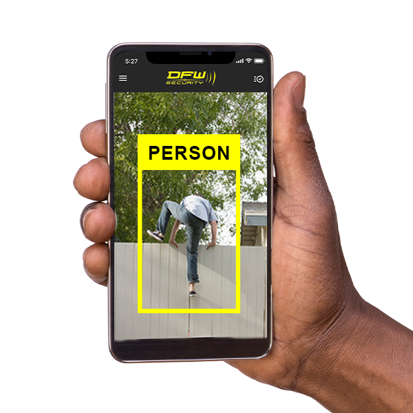 Home security app showing person climbing over fence on camera