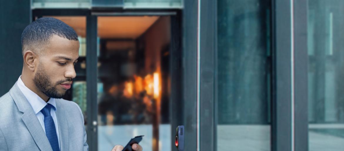 Man using his phone to unlock a door