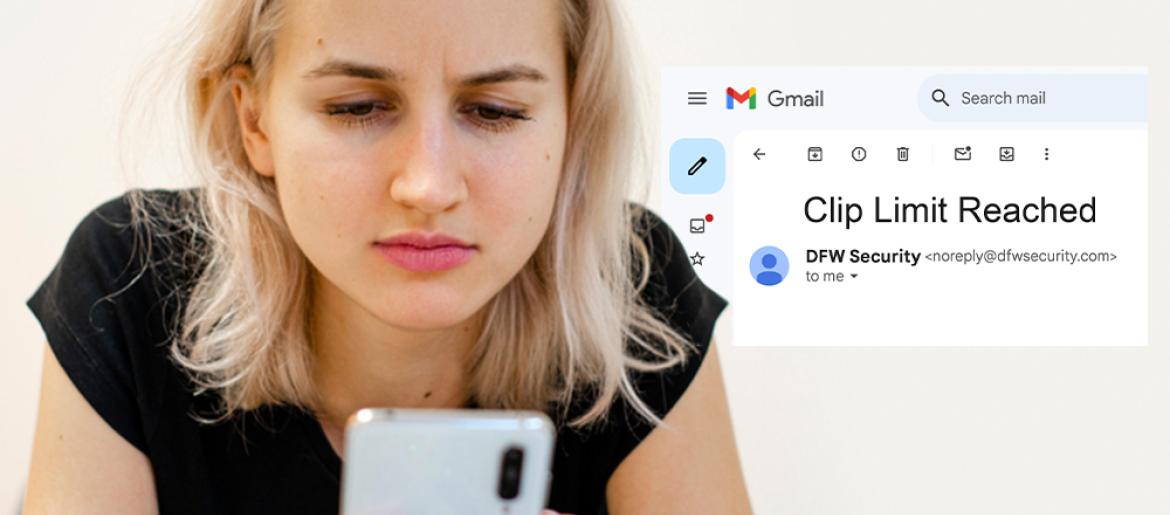 Woman looking at phone with a text alert about reaching her video clip upload limit
